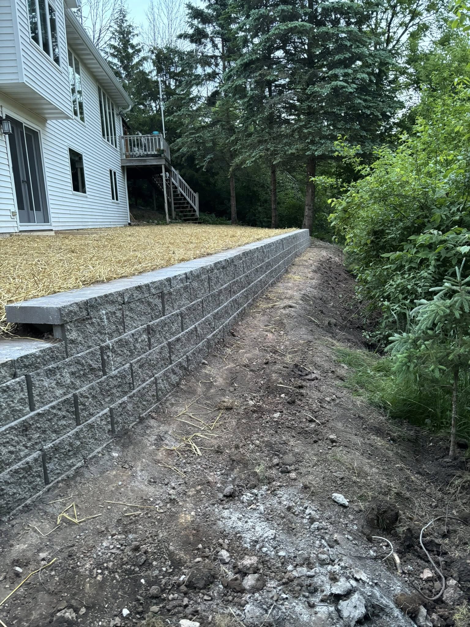 Terraced block retaining wall with landscaping in Sheboygan Falls, WI